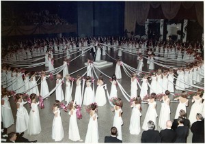 Historically a young woman’s debut was a public announcement of her eligibility to marry. Here, participants in the 1967 North Carolina Debutante Ball perform the traditional cartwheel dance. Willie Kay designed for clients who had the means and status to participate in such functions. Courtesy of Mrs. Elizabeth Converse 
